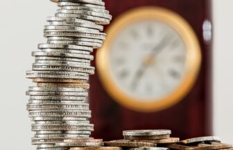 selective focus photo of stacked coins