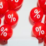 red balloons with percent sign
