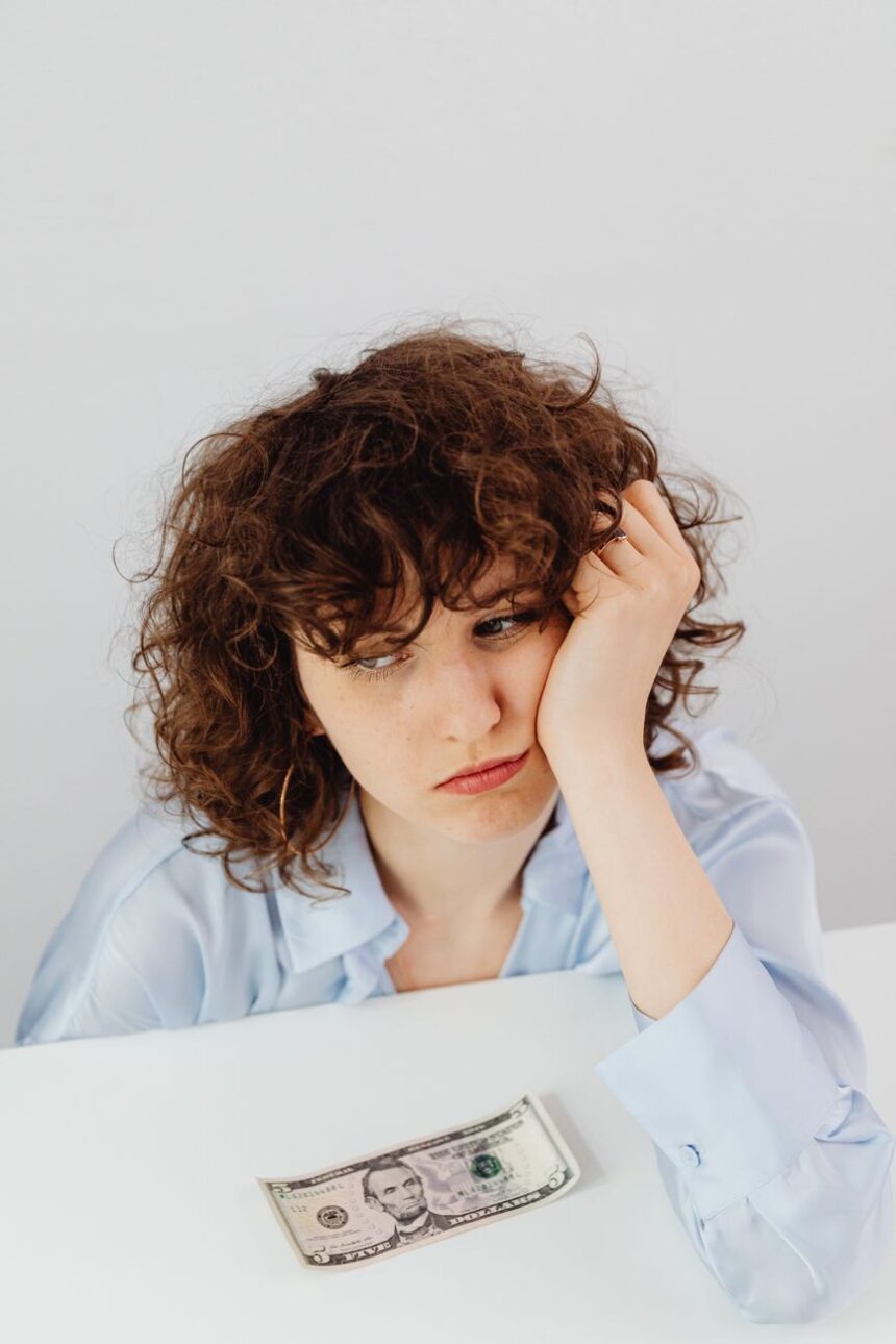 curly haired woman having a financial problem