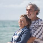 elderly couple hugging
