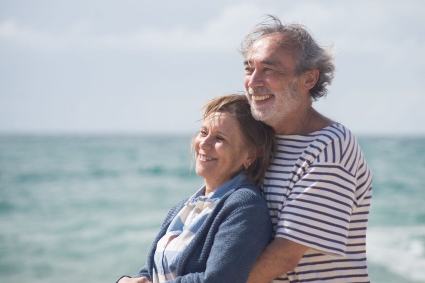 elderly couple hugging