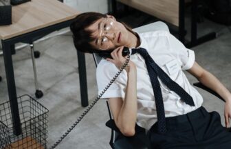 man wearing eyeglasses on a phone call