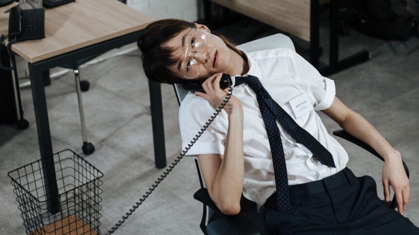 man wearing eyeglasses on a phone call