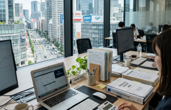 Person using calculator and laptop at office desk with financial reports and city buildings outside large windows